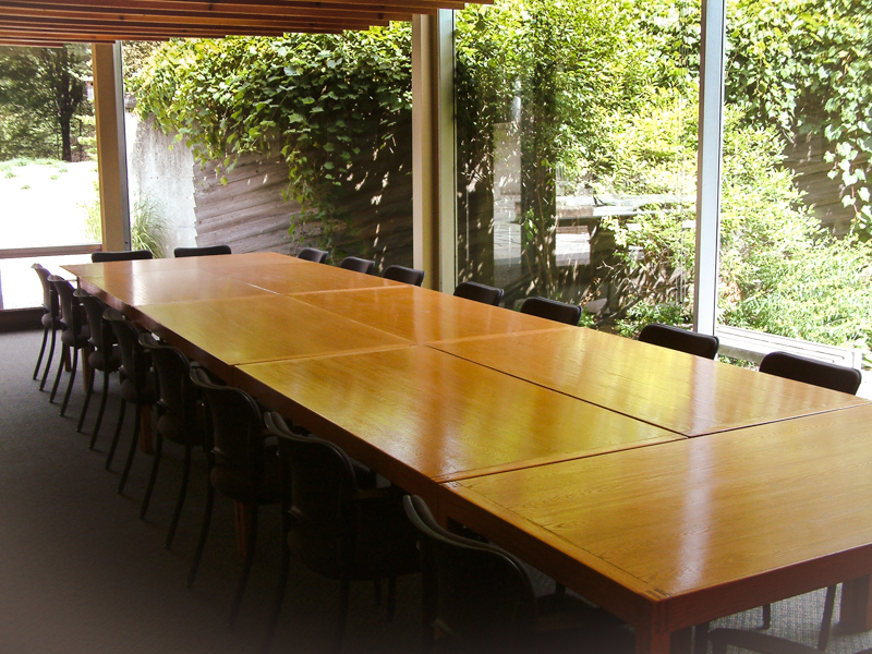 photo of boardroom table and outdoor courtyard