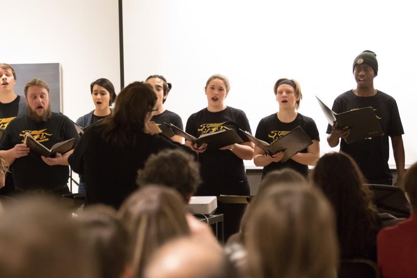 Picture of Gryphon Singers singing in front of an audience.