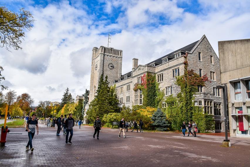 University of Guelph community members walking on campus near Johnston Hall