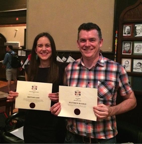 Luby and Hayday with award certificates