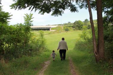 J.R. (Tim) Struthers, "Grandpa Tim," with his littlest grandson, Reed Gallan, at the Meneseteung, Saltford, near Goderich, Ontario, August 2015 Photo Credit: Joy Struthers