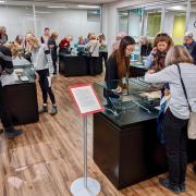 Members of the public view the exhibit