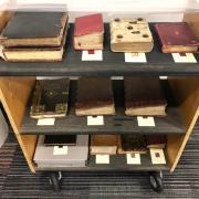 Manuscripts on book cart