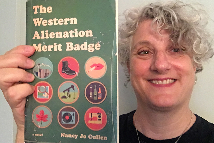 Nancy Jo Cullen with her book The Western Alienation Merit Badge