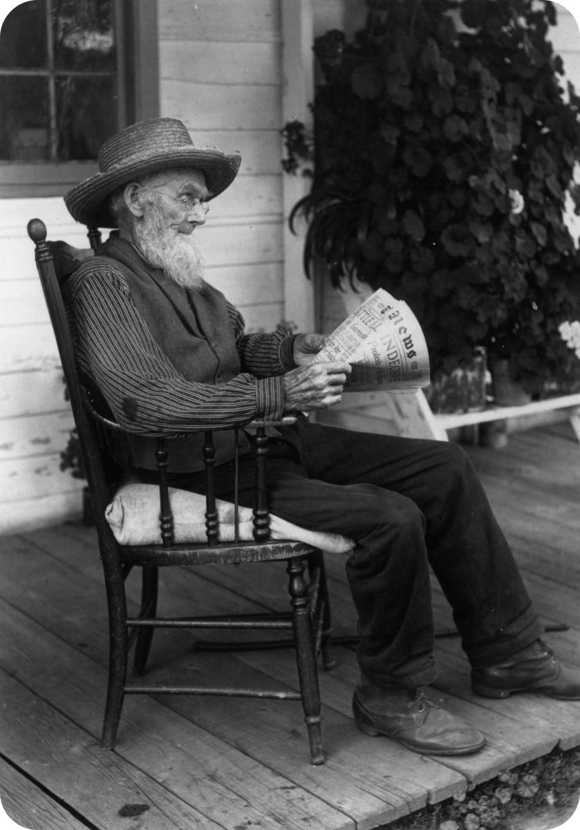 man reading newspaper