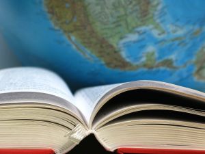 Image of book and globe.