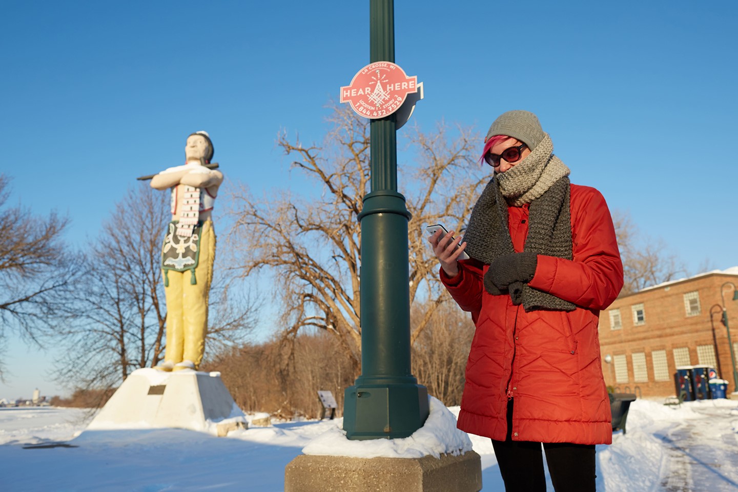 Picture of Ariel Beaujot standing in front of an Indian statue.