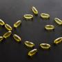 Fish oil capsules arranged in the shape of a fish