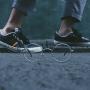 A person walking by eye glasses on the ground