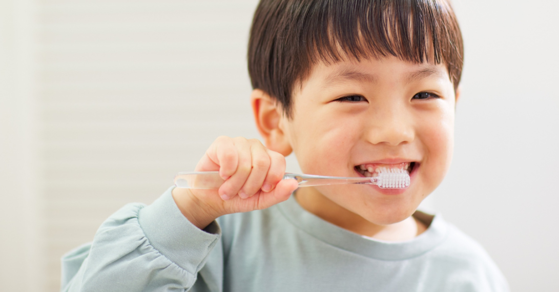 Child brushes his teeth