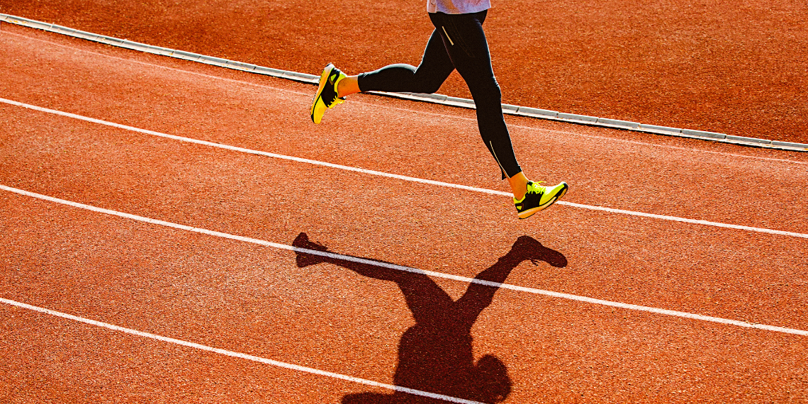 Someone jogging on a track