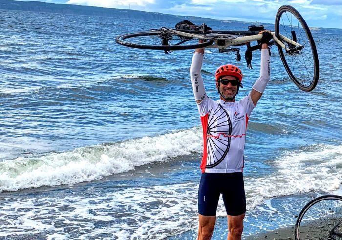 Steve Iseman with bicycle at the ocean shore