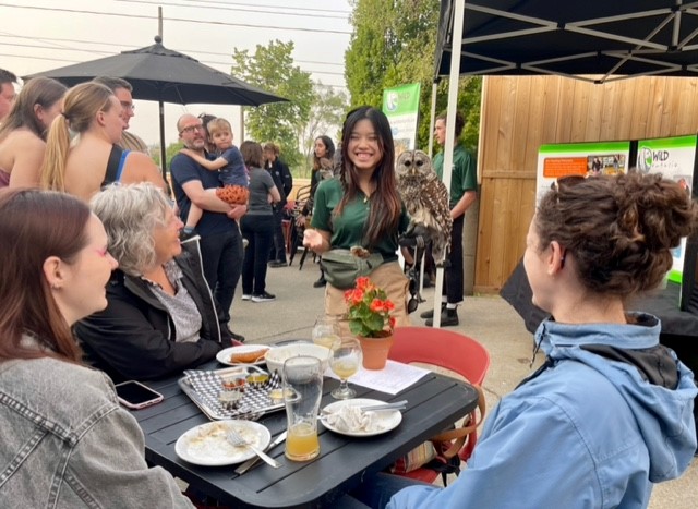 Wild Ontario volunteer presents to guests