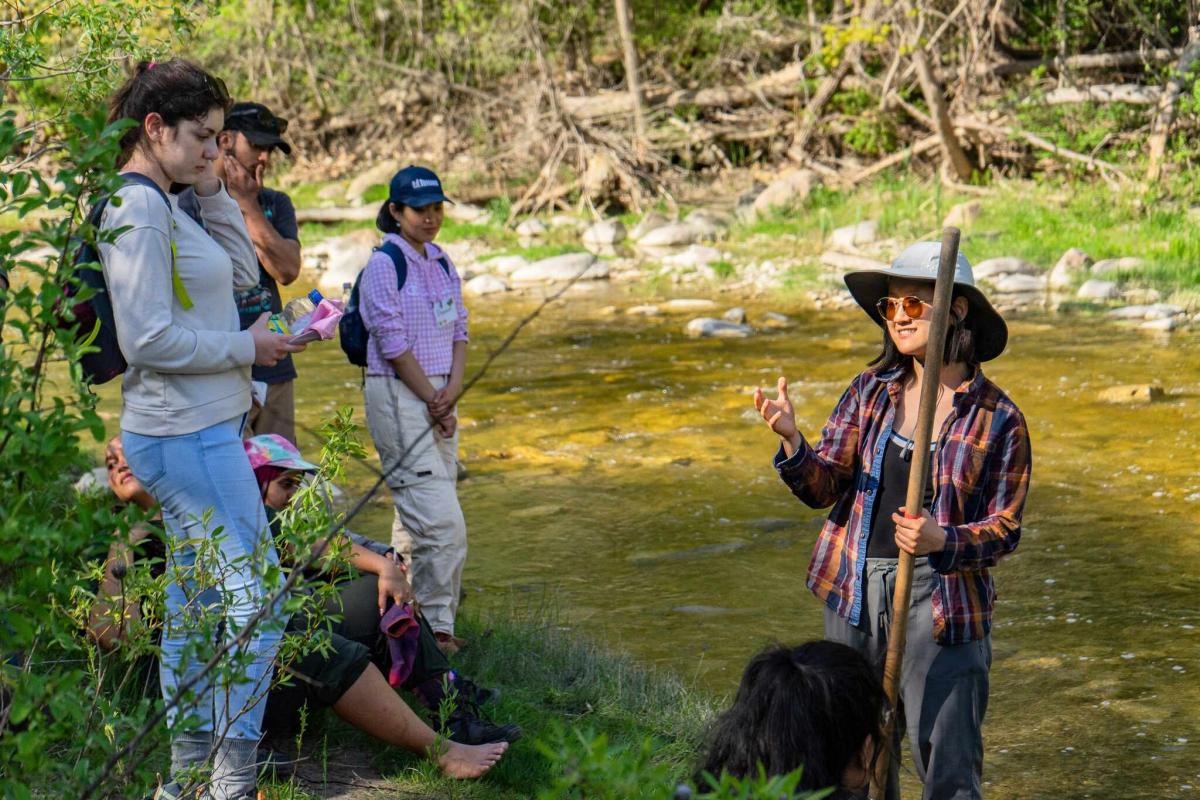 Participants learn "kick" aquatic sampling techniques from Sally Ju from Environment and Climate Change Canada at Rouge National Urban Park.