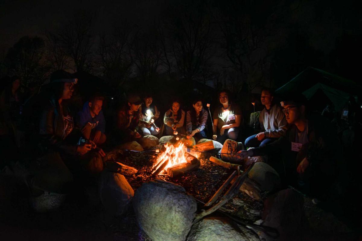 Students enjoy marshmallows during the Indigenous storytelling campfire. 