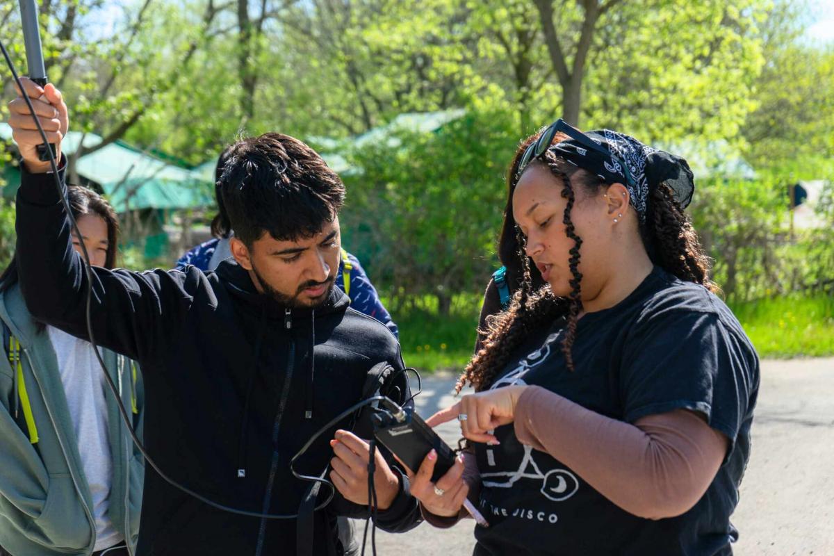 Students use telemetry equipment to track and find tags hidden around the Toronto Zoo Bush Camp, led by organizer and U of G PhD student Alannah Grant.