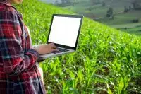Biologist in the field with a laptop