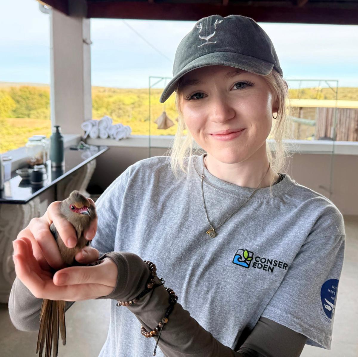 Jenn Smith holds a bird