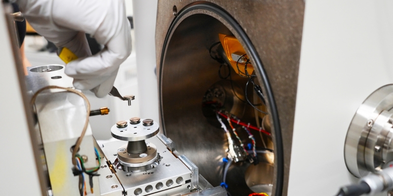Mojda inserts samples into a transmission electron microscope