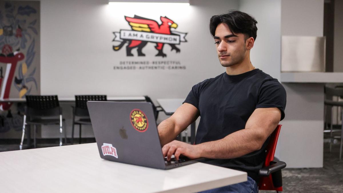 Pareesh Madan typing on a laptop.