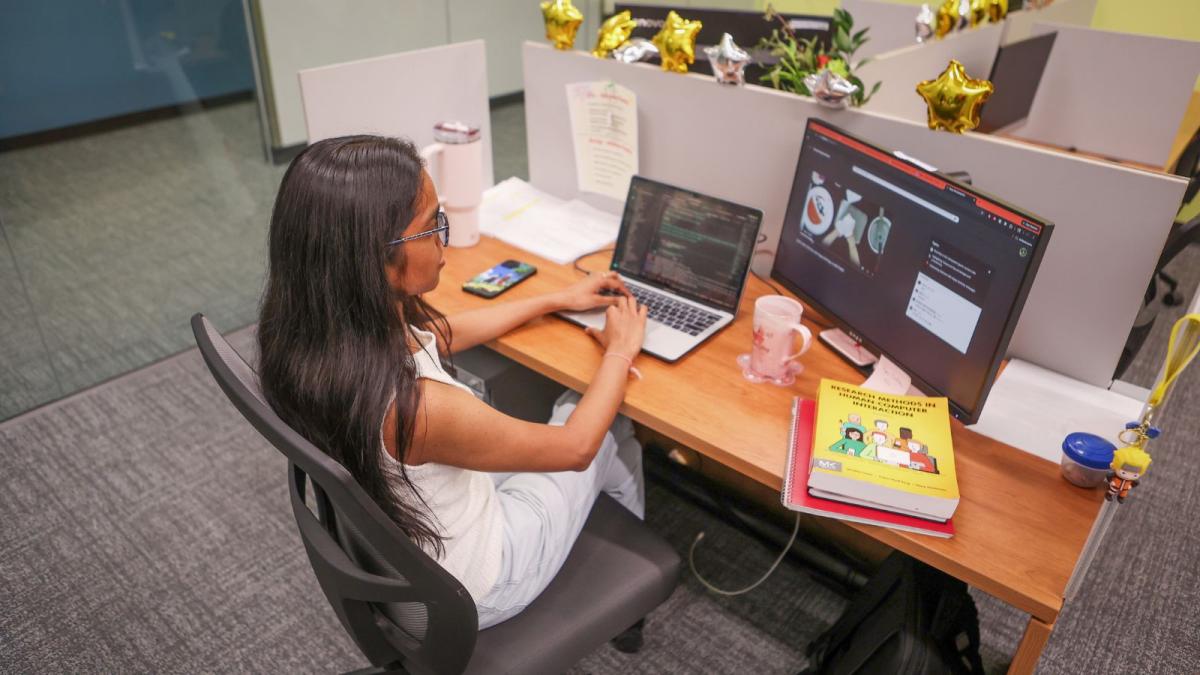Mahek Patel on her laptop.