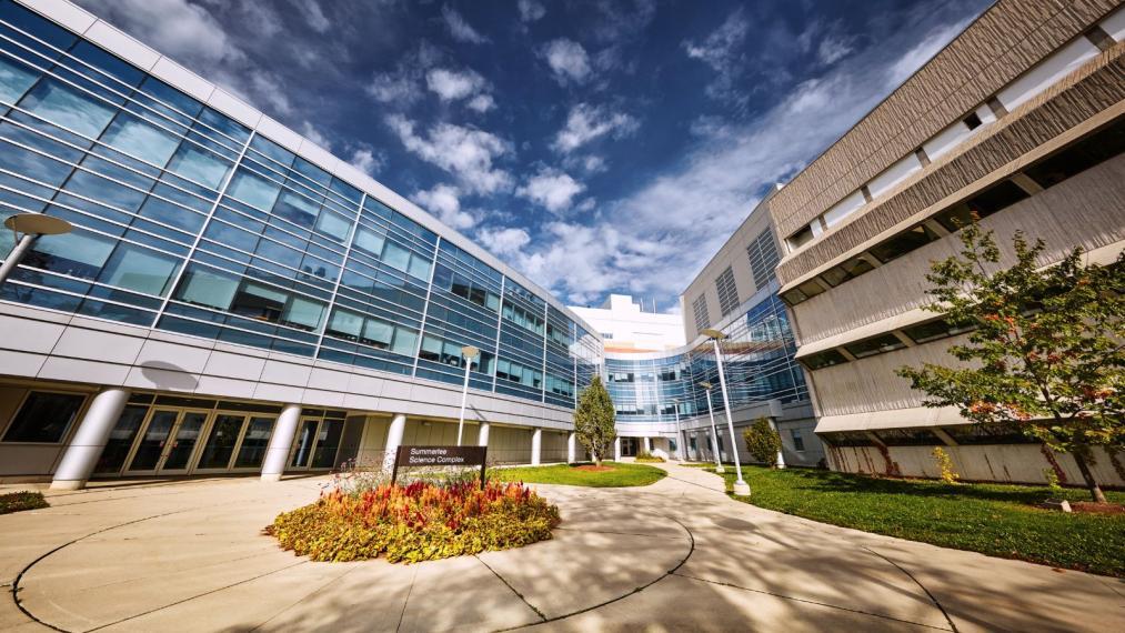Outside of the Summerlee Science Complex on a bright summer day.