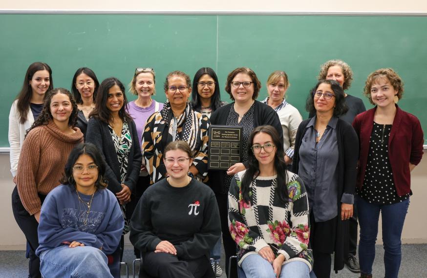A group of staff, students and faculty standing together with Dr. Dean