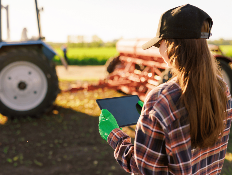 A farmer holding a tablet.
