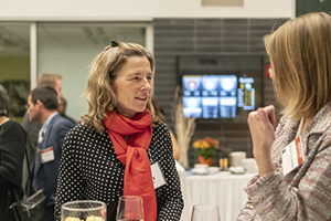 Mary chatting with an attendee