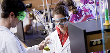 Two students working together in lab