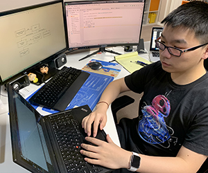 Chenxingyu (Alex) Chen working on computer