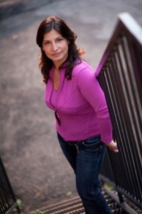 Dr. Monica Cojocaru standing on stairs