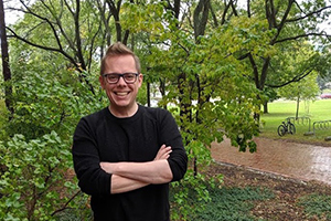 Image of Dan Gillis in front of trees