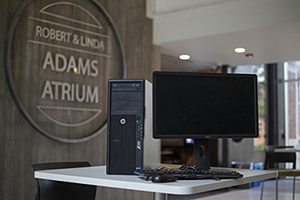 Image of computer loan package with Robert & Linda Adams Atrium sign in background