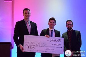 First place winners for Re-Engineering holding check