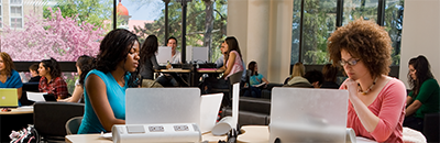 Stock image of students in library/computer room