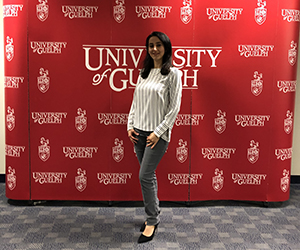 Sanaz Nakhodchi in front of University of Guelph backdrop