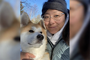 Headshot of Leanne Chen with her dog