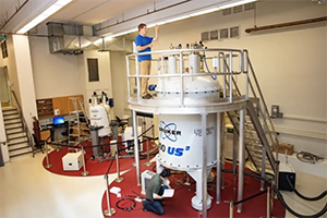 Graduate students working in physics lab