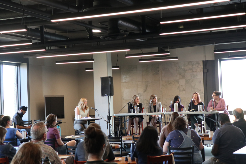 Picture of audience and panel at event