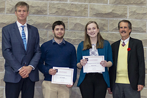 Two award recipients stand with John Runciman (director, school of engineering) and Bill Winegard (donor representative)