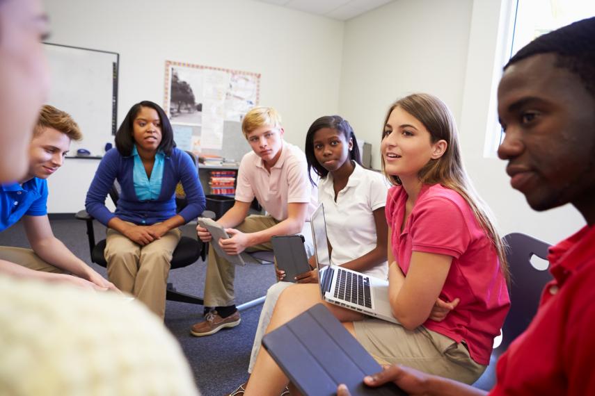 Class of students of multiple different cultures having a discussion. 