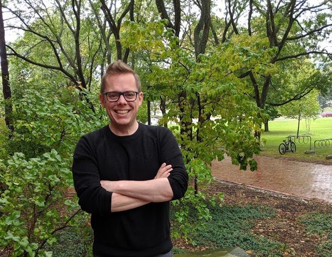 Dan Gillis in front of trees on the University of Guelph campus.