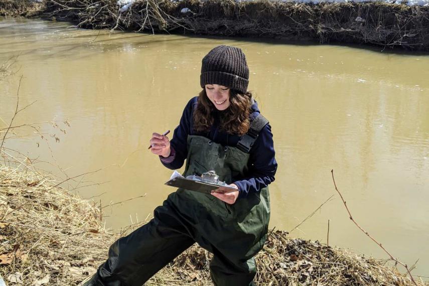 Hannah May conducting field work in watershed