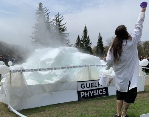 Physicist standing in front of the world record soap bubble foam creation
