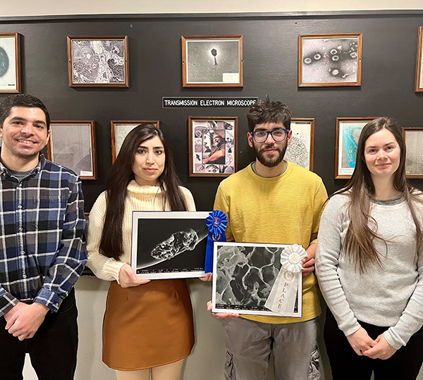 The two winners standing with their supervisor and facility coordinator. From left, Dr. Abdallah Elsayed, Sevda Fathipour, Gautam Naresh Genani, and Dr. Elyse Roach