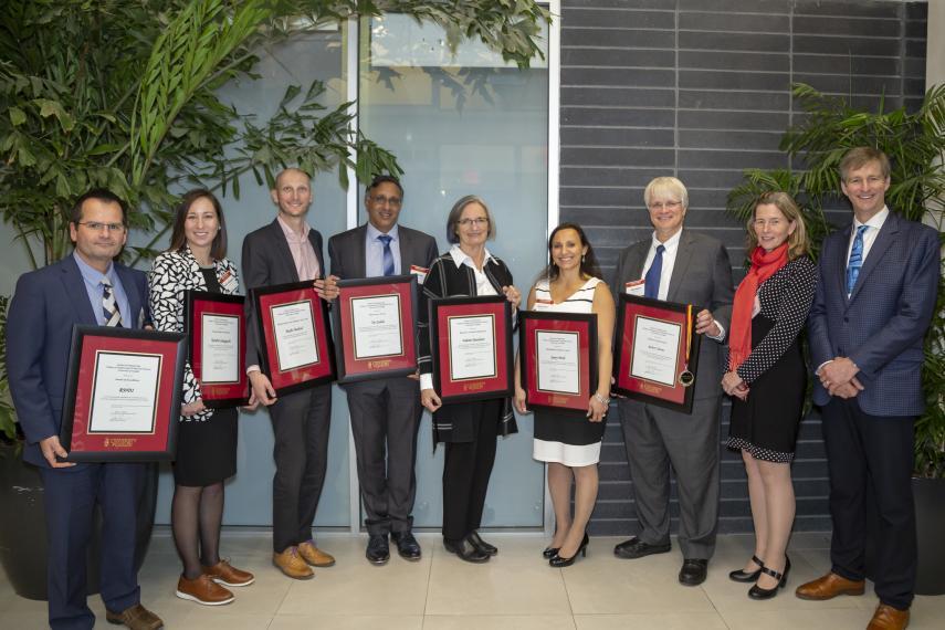 Group of winners and faculty standing together