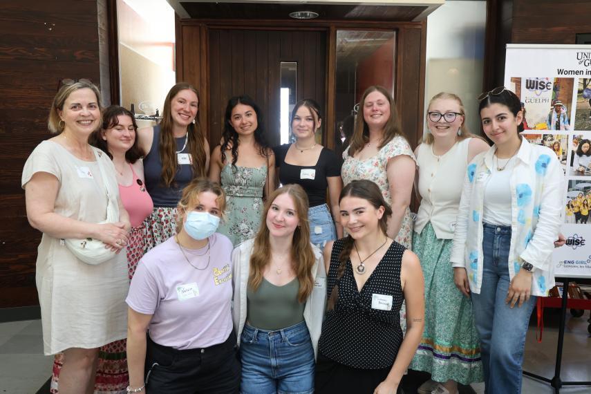 A group of student leaders and event organizers standing together smiling.
