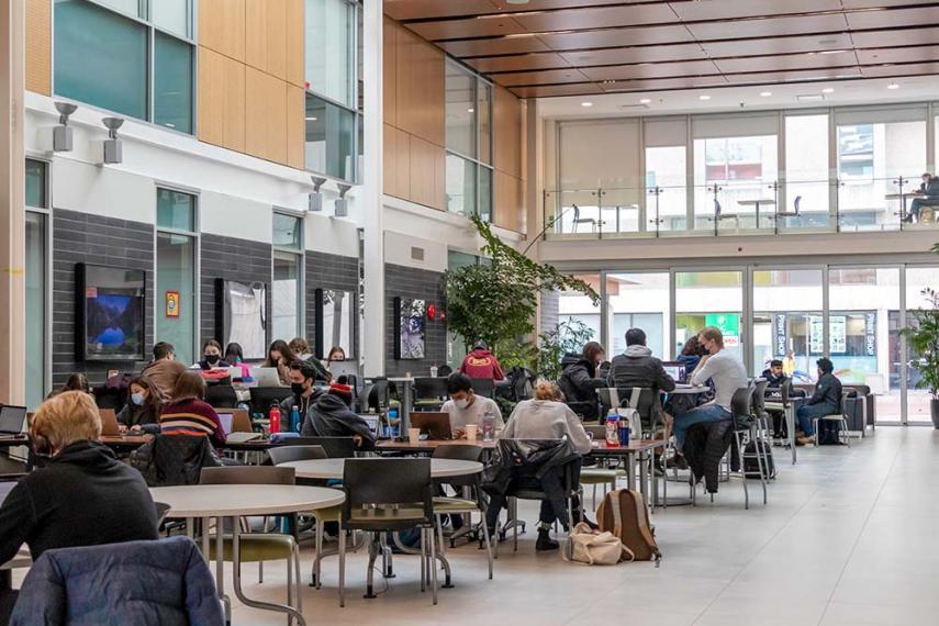 Students sitting at tables studying inside the Engineering building at the University of Guelph.