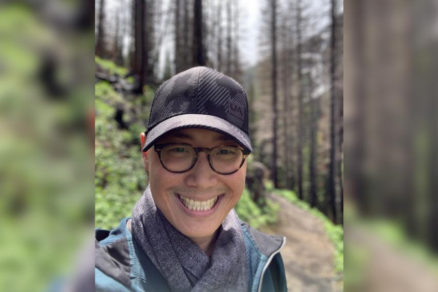 Headshot of Edward Kim hiking in mountains